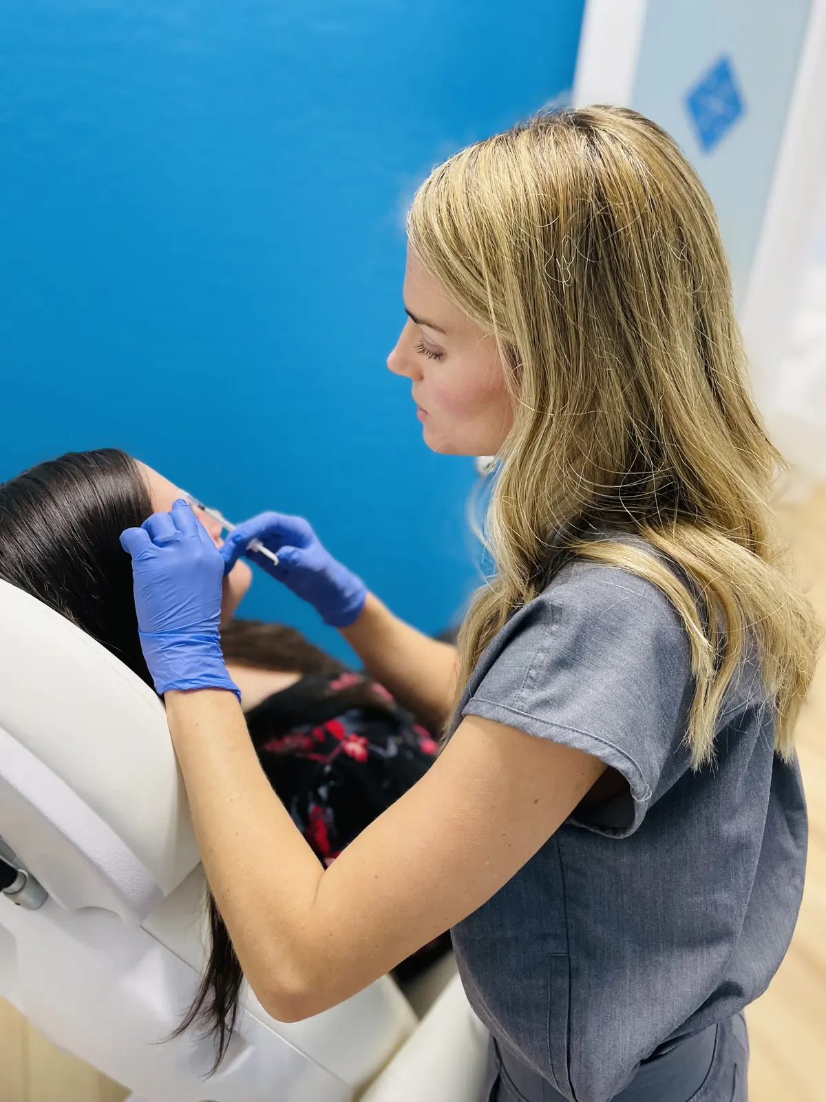 A Nascent Health provider performing a scalp treatment
