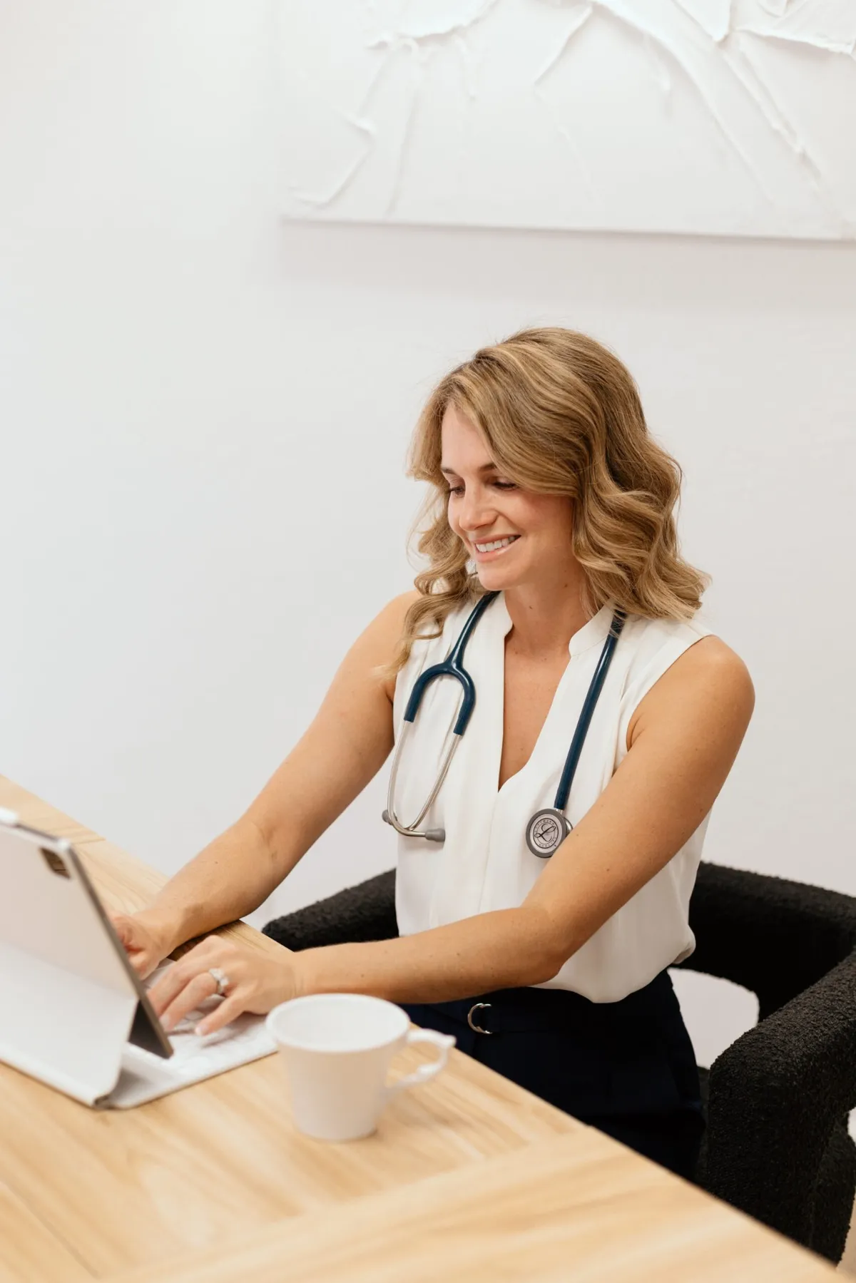 Dr. Ashley Southern working with patient records at her desk