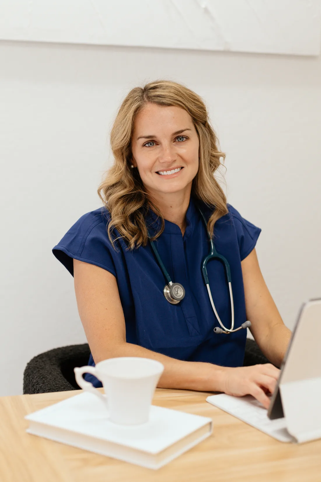 Dr. Ashley Southern at her desk with a laptop